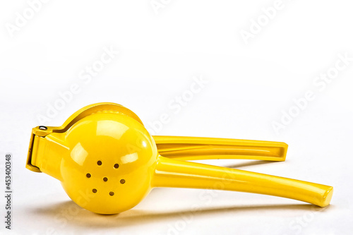 Schilderij op canvas Manual yellow lemon squeezer isolated on white background
