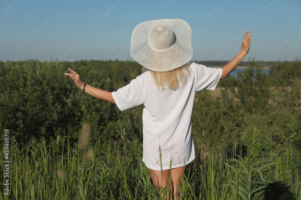 young happy woman in a field