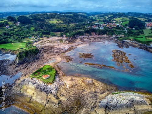 Hermitage located on an island off the coast of asturias, Spain, near Luanco. photo