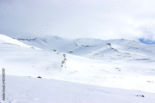 a mountain pass covered with snow, the photo express a feeling of cold and loneliness. single tourism safety concept.
