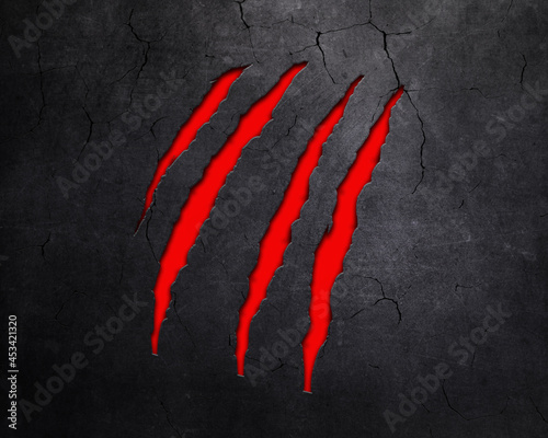 Animal claw marks in metallic background with red underlay photo