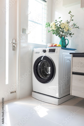 Luxury modern kitchen interior with washing machine.
