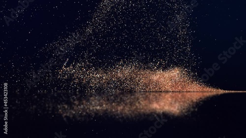 Happy New Year. Gold glitter on dark blue. The appearance of text from glowing particles.
