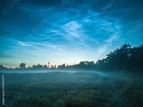 misty night with noctilucent clouds