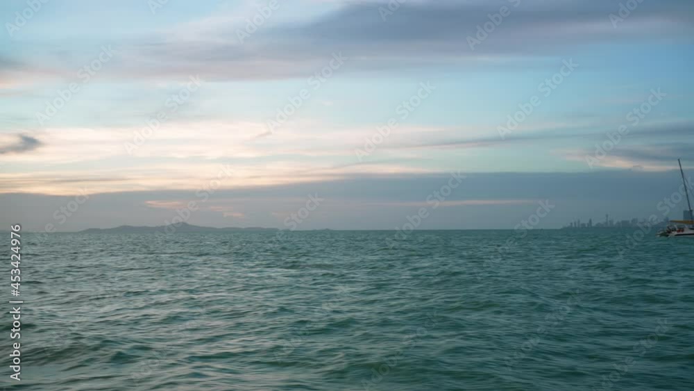 blue ocean view from sailboat at sunset blue ocean view from sailboat at sunset