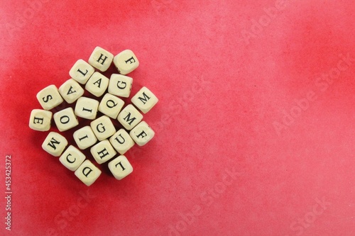 Alphabetical letters on wooden cubes with copy space on the edges © Fauzi