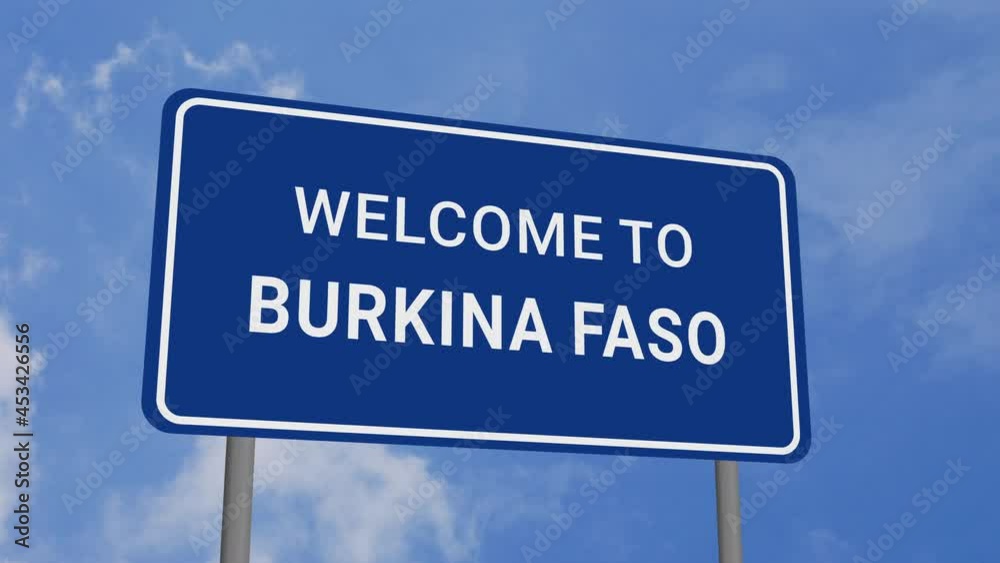 Welcome to Burkina Faso Road Sign on Clear Blue Sky with Rapid Moving Clouds