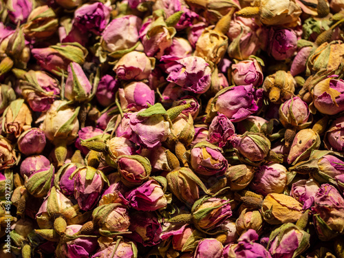 dried rose buds on a counter, selective focus