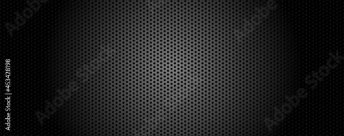 Black metal with lighting, texture steel abstract and background. Perforated sheet metal, engineering material concept