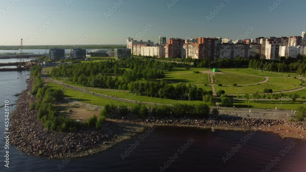 Drone flight over the city beach on a sunny day, where many people are resting. Flight over the park of the 300th anniversary. Saint Petersburg, Russia Drone flight over the city beach on a sunny day, where many people are resting. Flight over the park of the 300th anniversary. Saint Petersburg, Russia