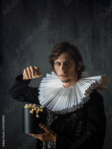 Canvas Print young noble man in a medieval round collar is indignant at the film adaptation,