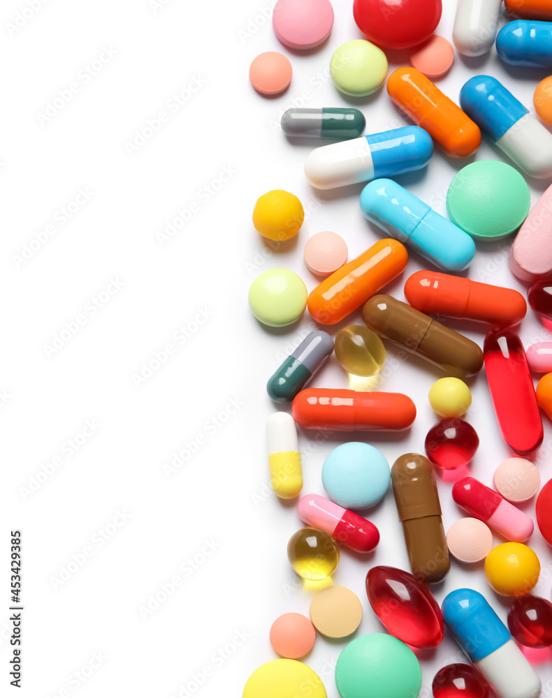 Lots of different colorful pills isolated on white, top view