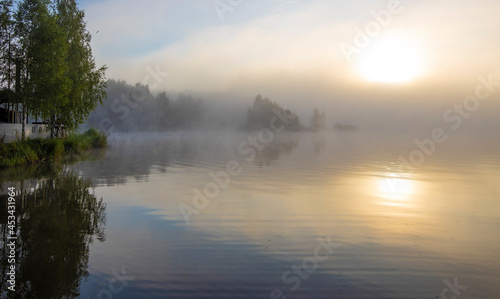 Early morning. Fog on the river. Beautiful sunrise in the summer by the river.River on an early summer morning at dawn.