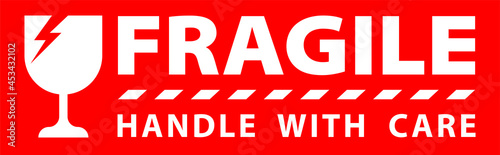 sticker fragile handle with care, red fragile warning label, fragile label with broken glass symbol photo