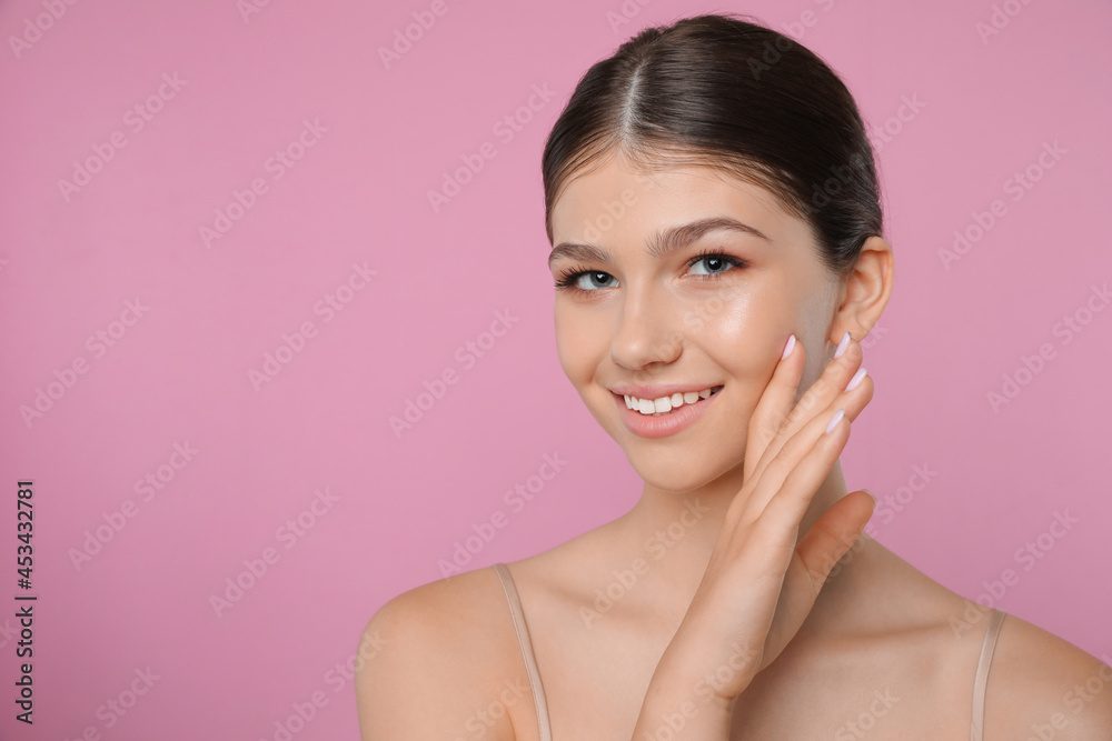 Portrait of pretty girl on pink background, space for text. Beautiful face with perfect smooth skin Portrait of pretty girl on pink background, space for text. Beautiful face with perfect smooth skin