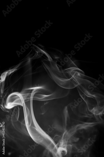 White smoke on black background.