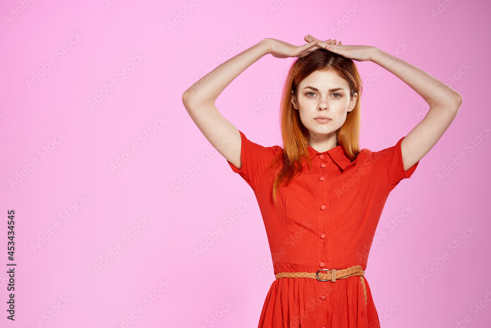 red-haired woman in red dress posing attractive look studio red-haired woman in red dress posing attractive look studio