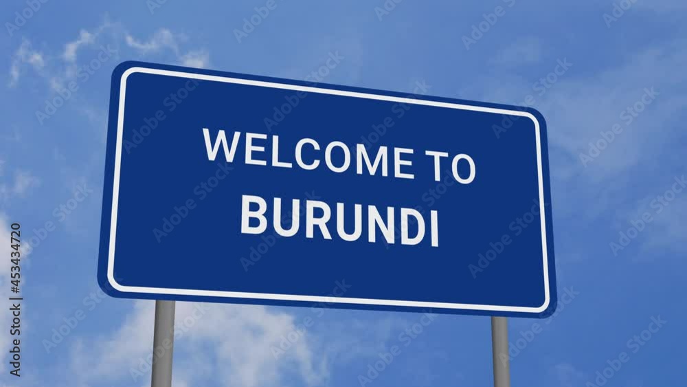 Welcome to Burundi Road Sign on Clear Blue Sky with Rapid Moving Clouds Welcome to Burundi Road Sign on Clear Blue Sky with Rapid Moving Clouds