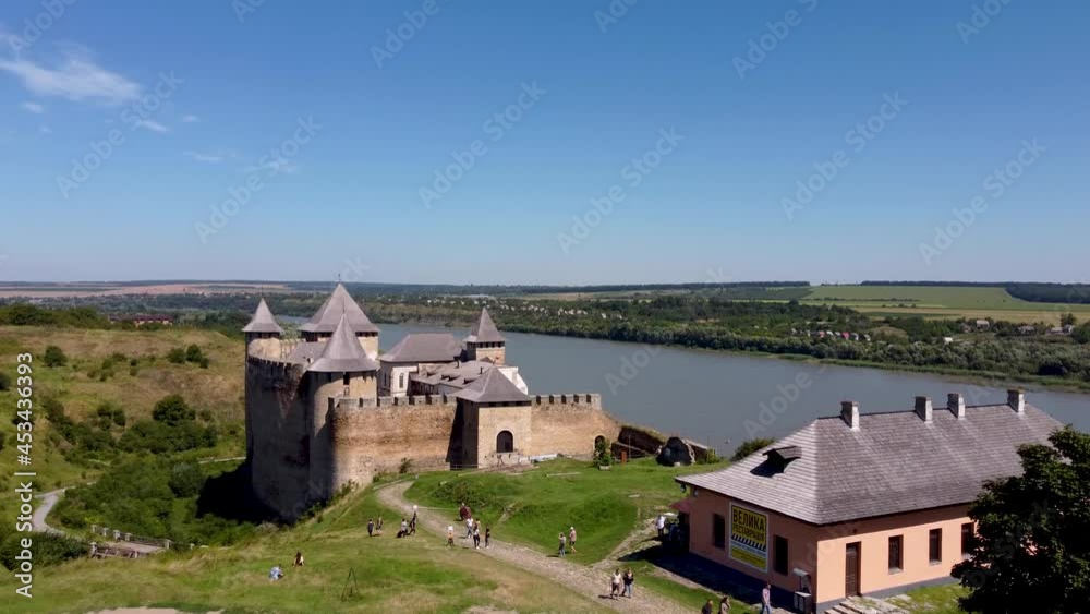Khotyn fortress from a bird's eye view. Flight over the Fortress in Khotyn, Ukraine. Historical monuments of Ukraine. Historic castle. Fortress on the banks of the Dniester. History of Ukraine. Khotyn fortress from a bird's eye view. Flight over the Fortress in Khotyn, Ukraine. Historical monuments of Ukraine. Historic castle. Fortress on the banks of the Dniester. History of Ukraine.