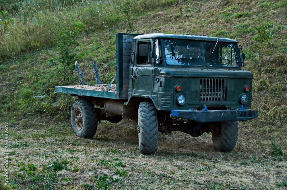 Old military truck, adapted and used for transporting wood from the forest, Vasilyovo, Bulgaria Old military truck, adapted and used for transporting wood from the forest, Vasilyovo, Bulgaria