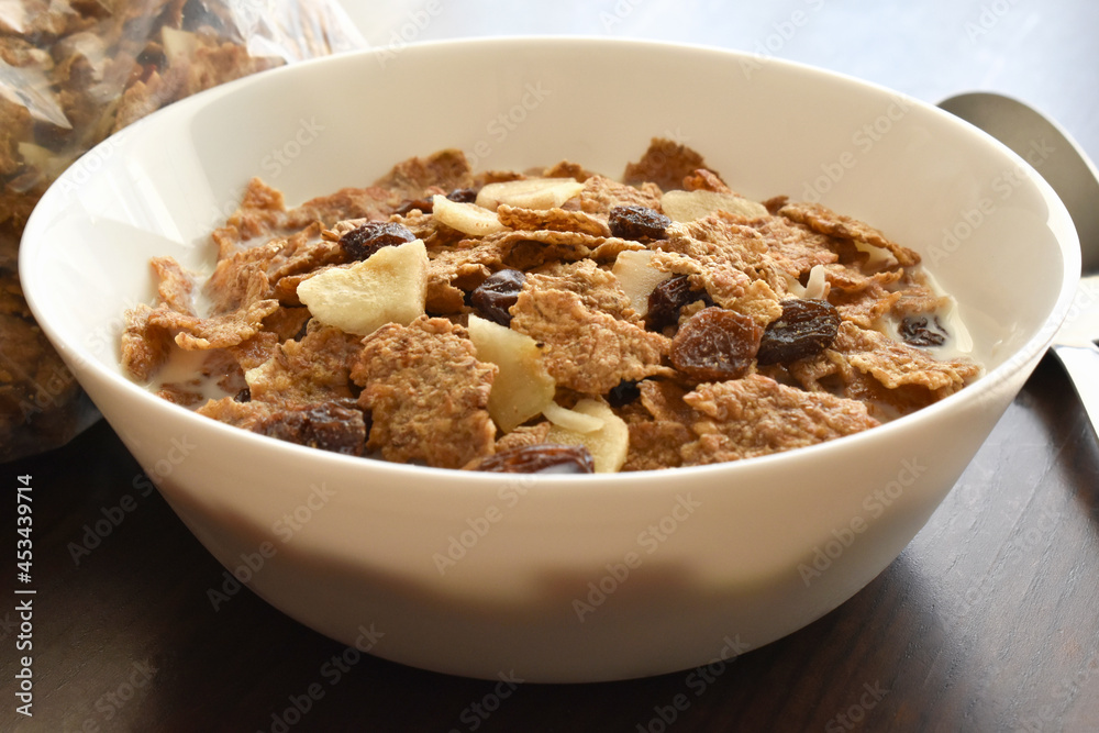 Fruit and fiber cereal with milk closeup in a bowl. The concept of healthy breakfast, healthy food, dietary plan and weight loss program. Fruit and fiber cereal with milk closeup in a bowl. The concept of healthy breakfast, healthy food, dietary plan and weight loss program.