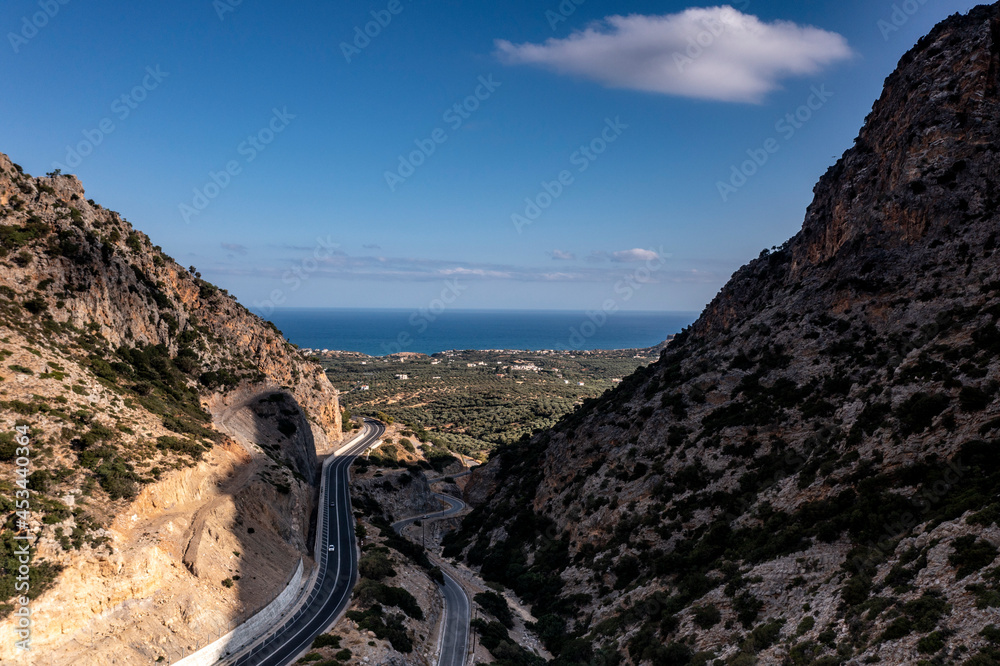 panoramic view of the Greek landscape with mountains and sea of Crete island filmed from a drone 