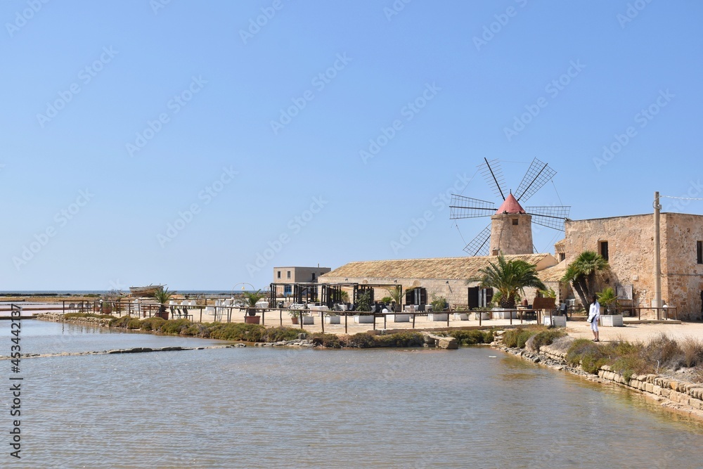Old windmill in the Salina of Trapani, Sicily, Italy