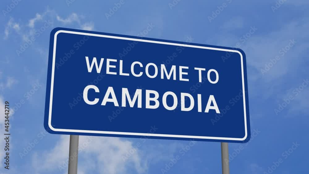 Welcome to Cambodia Road Sign on Clear Blue Sky with Rapid Moving Clouds Welcome to Cambodia Road Sign on Clear Blue Sky with Rapid Moving Clouds