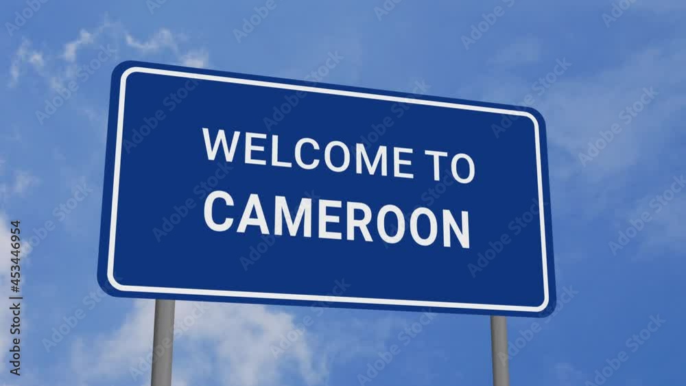 Welcome to Cameroon Road Sign on Clear Blue Sky with Rapid Moving Clouds Welcome to Cameroon Road Sign on Clear Blue Sky with Rapid Moving Clouds
