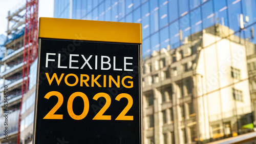 Wallpaper Mural Flexible Working 2022 on a city-center sign in front of a modern office building Torontodigital.ca