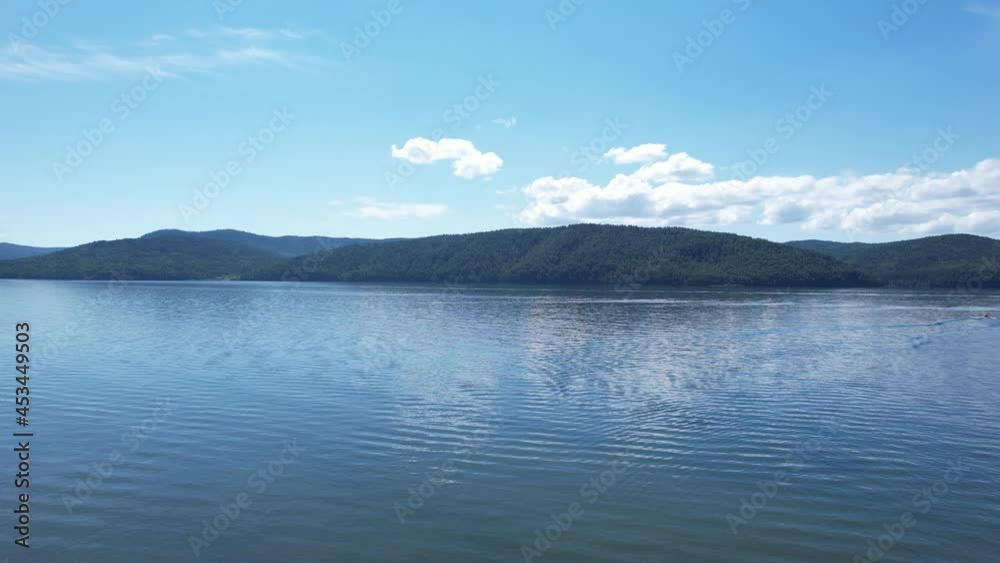 The Angara River is a major river in Siberia leaving Lake Baikal near the settlement of Listvyanka. Panoramic aerial view. The Angara River is a major river in Siberia leaving Lake Baikal near the settlement of Listvyanka. Panoramic aerial view.