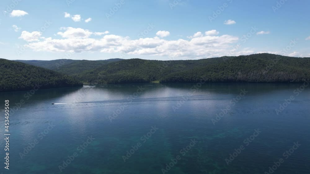 The Angara River is a major river in Siberia leaving Lake Baikal near the settlement of Listvyanka. Panoramic aerial view.