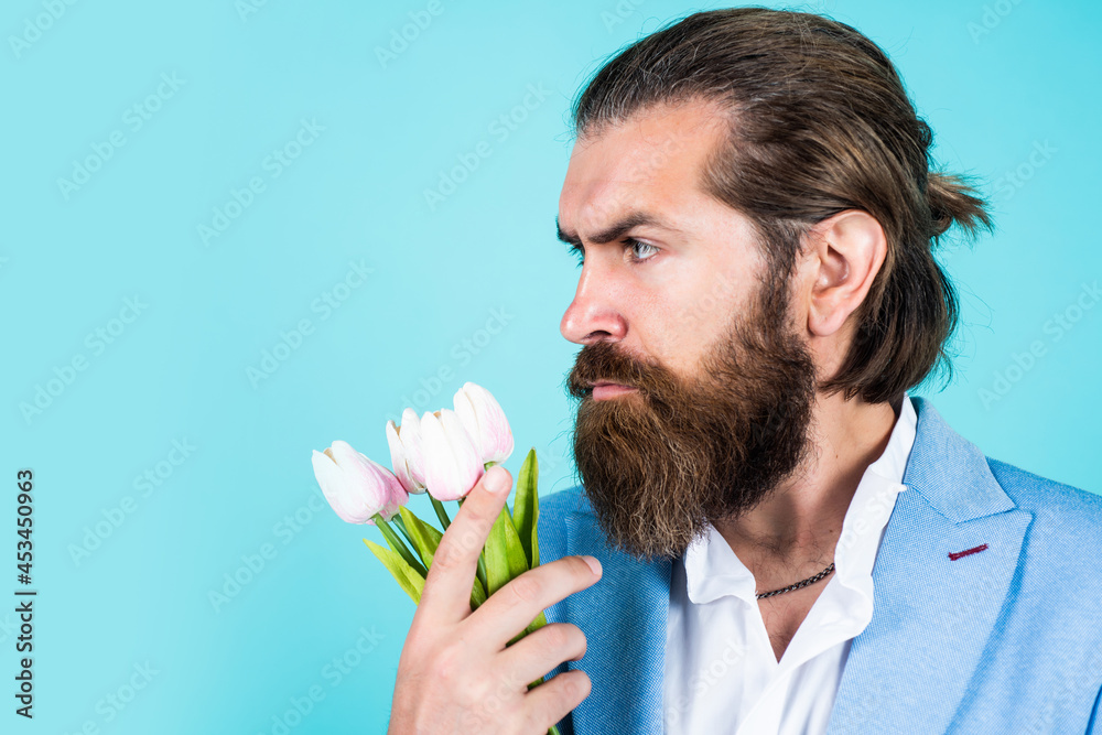mature bearded male guy looking elegant with spring tulips, summer mature bearded male guy looking elegant with spring tulips, summer