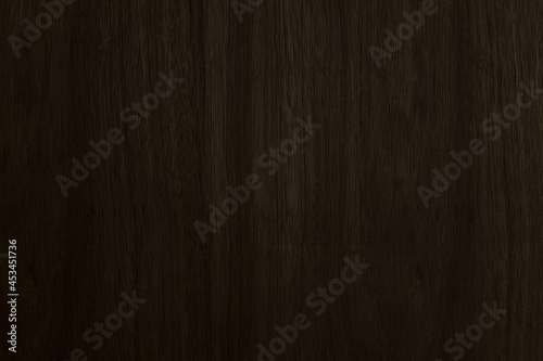 Dark brown plywood with broken pattern on surface for texture and background