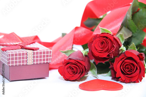 Gift box and red roses. Heart.