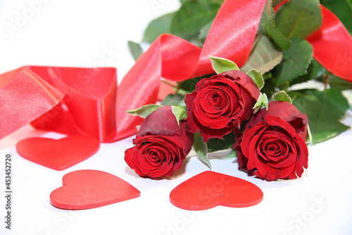 Gift box and red roses. Heart.