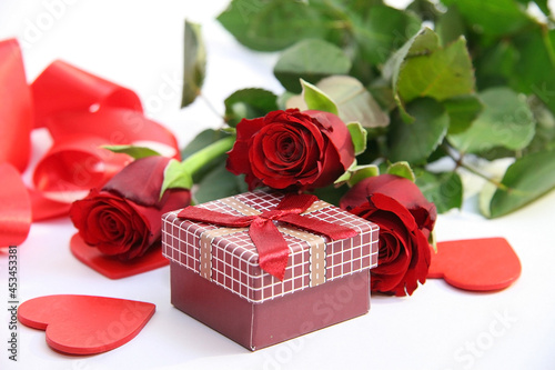 Gift box and red roses. Heart.