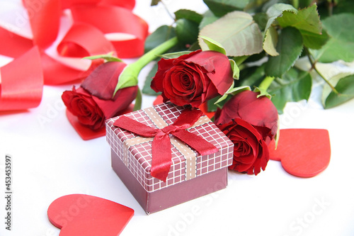 Gift box and red roses. Heart.