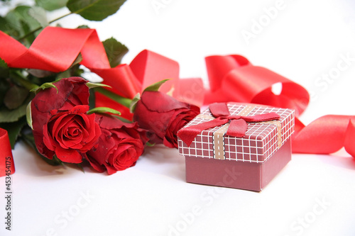Gift box and red roses. Heart.
