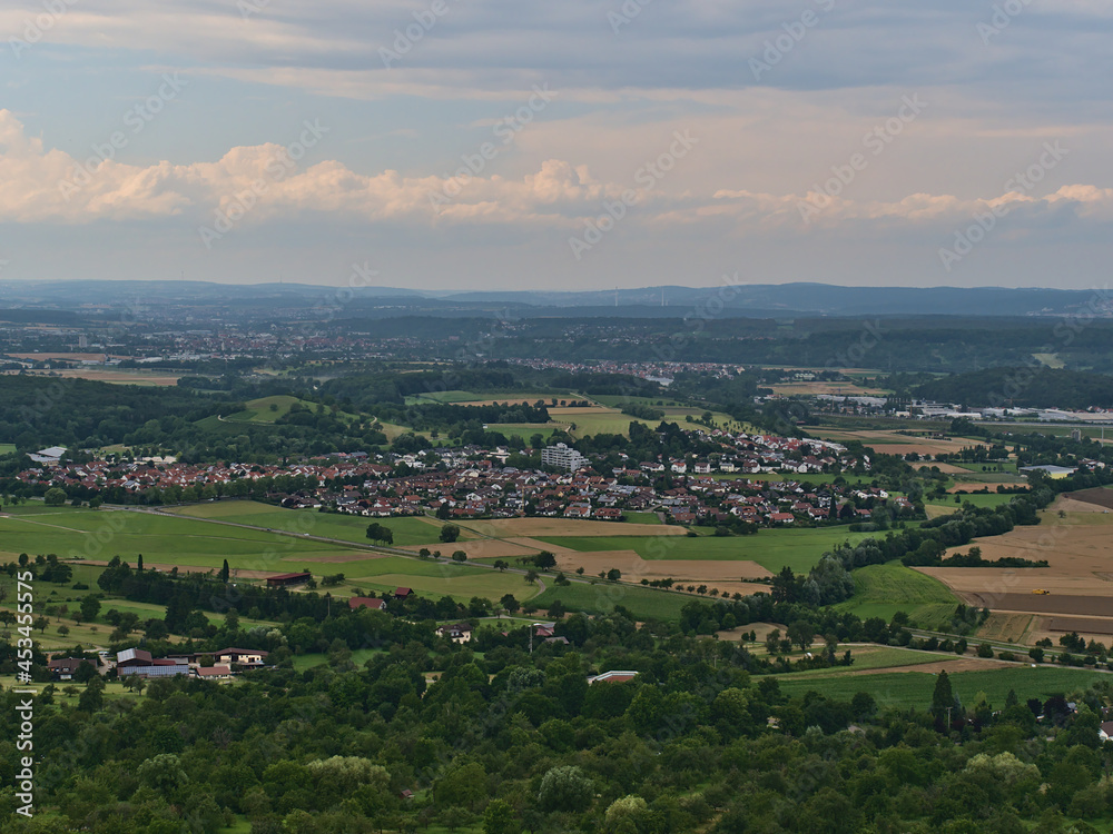 Aerial view of landscape with small village Nabern, part of Kirchheim unter Teck, Baden-Württemberg, Germany, surrounded by agricultural fields.