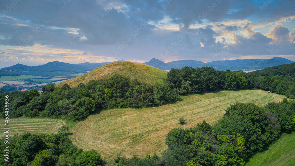 View on the protected landscape area Czech Central Mountains from the top of the hill Kostalov, Czech republic - panorama