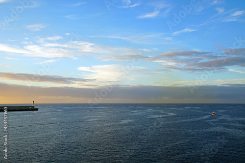 The magic of the ocean. Sunrise over the Atlantic. Horizon and endless space. Beautiful view. Clouds © Anatoliy