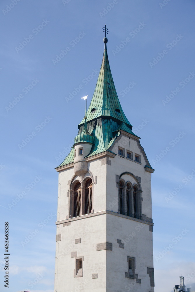 Newer church tower of schwaz in front of blue sky
