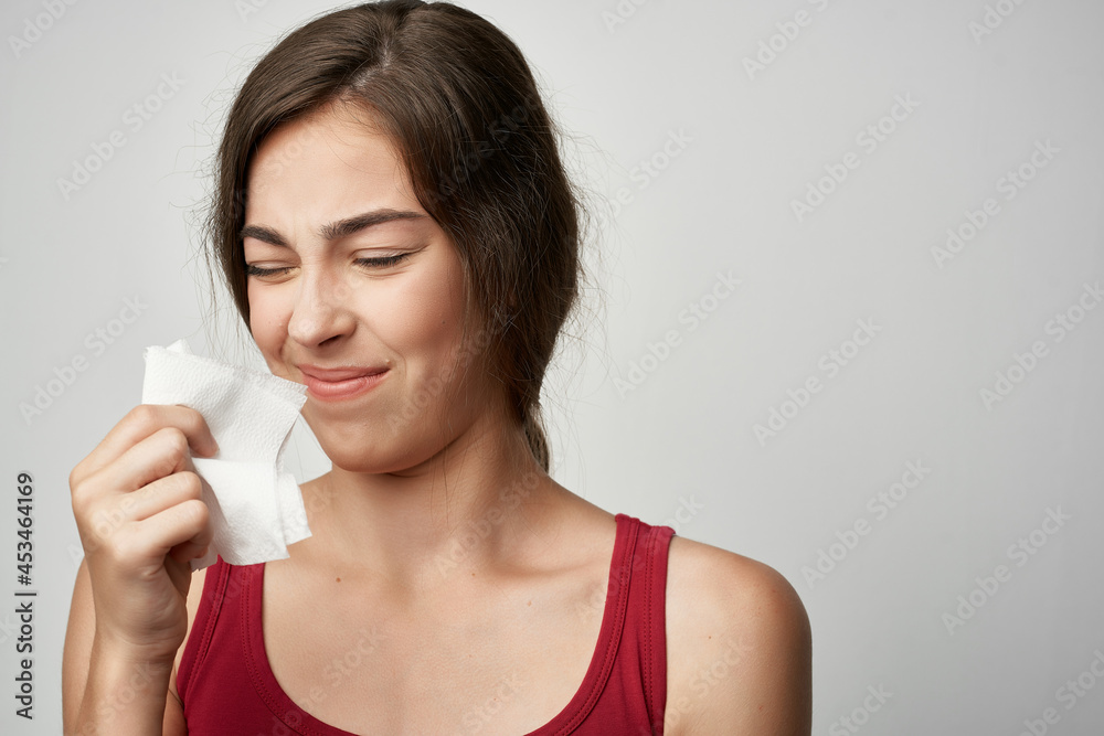 woman wipes her nose with a handkerchief health problems woman wipes her nose with a handkerchief health problems