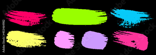 Set of colorful brush strokes. Dirty grunge texture. Different grunge brush strokes. Dirty artistic design elements isolated on black background. Neon colorful ink. Vector illustration