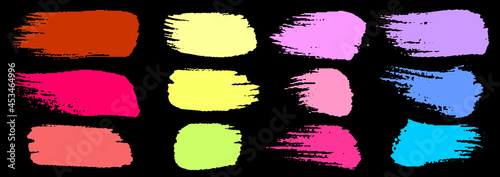 Set of colorful brush strokes. Dirty grunge texture. Different grunge brush strokes. Dirty artistic design elements isolated on black background. Neon colorful ink. Vector illustration