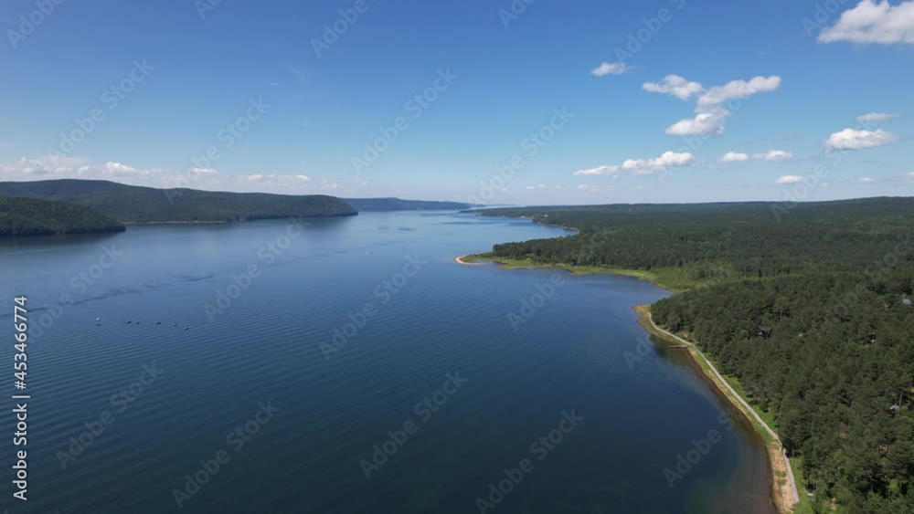 The Angara River is a major river in Siberia leaving Lake Baikal near the settlement of Listvyanka. Panoramic aerial view.