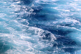 Sea foam and deep blue sea. Selective focus.