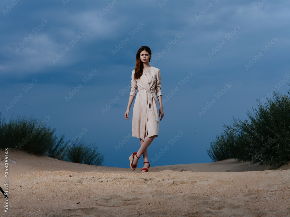 beautiful woman walk along the beach sand tropics lifestyle fashion