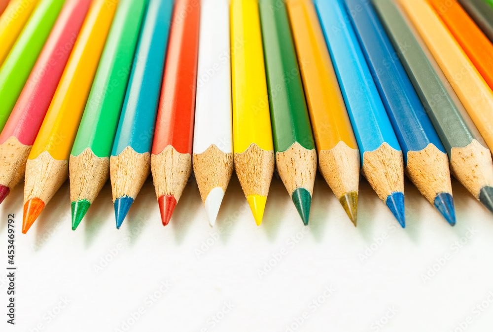 Front view image of various colored pencils. placed isolated on a white background and colored pencils in close-up.Concept art Text copy space and office Front view image of various colored pencils. placed isolated on a white background and colored pencils in close-up.Concept art Text copy space and office